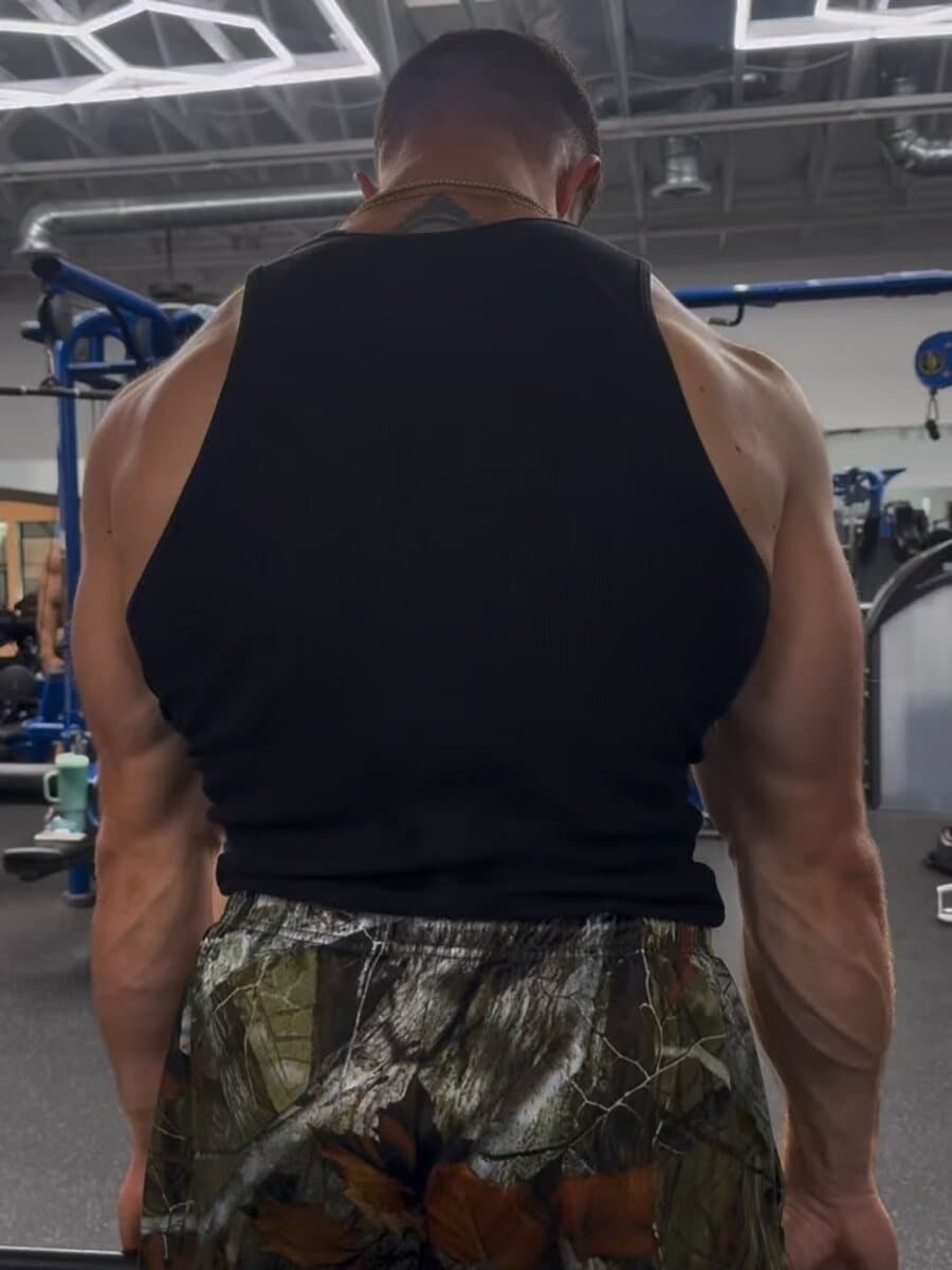 Brad Hills from behind, upper back and shoulders under load